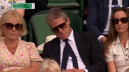 Hugh Grant apanha caldo em Wimbledon atrás da Rainha Camilla